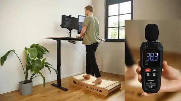 Someone walking on Woodway at a standing desk while a sound level meter reads 38 decibels